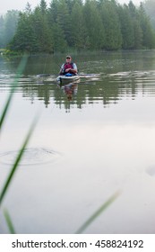 Middle Aged Man Kayak Fishing