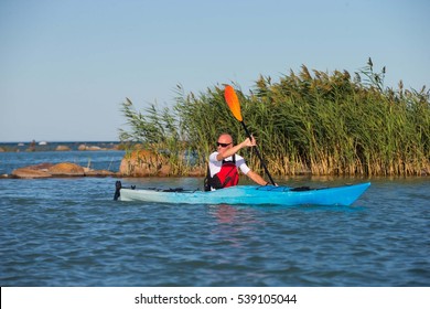 A Middle Aged Man Kayaking