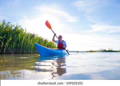 A Middle Aged Man Kayaking