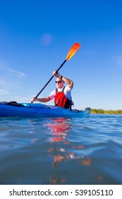 A Middle Aged Man Kayaking