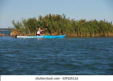 A Middle Aged Man Kayaking