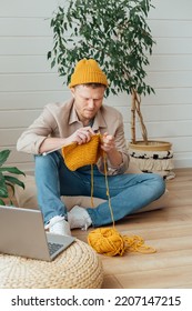 Middle Aged Man Knitting At Home. Knitting Project In Progress. Man Learning A New Hobby