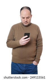 middle aged man looking down at his mobile cell smart phone                              