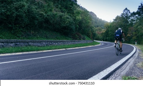 Middle Aged Man In Lycra Tackles A Tough Climb In The Italian Alps