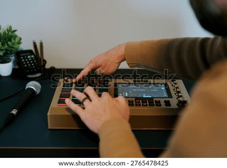 Middle Aged Man Making Hip Hop Beats on Hardware Sampler with Flashing Pads - Rap Music Producers in Danger with AI Music Concept