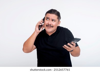 A middle aged man multitasking, talking to a client on the phone while answering questions via chat on another phone. A busy guy trying to respond to everyone. Isolated on a white background. - Powered by Shutterstock