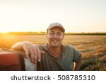 Middle aged man portrait on farmland. 