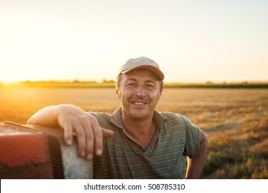 Middle aged man portrait on farmland. 