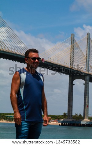 Middle aged man posing for photos during his vacation in Natal Brazil