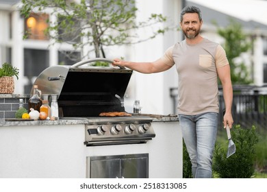 Middle aged man preparing barbecue grill outdoor. Man cooking barbecue grill at backyard. Chef preparing food on barbecue. Millennial man grilling meat on barbecue grill. Bbq party. Meal grilling. - Powered by Shutterstock