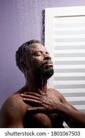 Middle Aged Man In Shower Cubicle, Taking A Shower Alone. He Stands With Eyes Closed, Skincare In The Morning