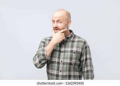 Emotive Positive Mature Male Covering Mouth Stock Photo (Edit Now ...