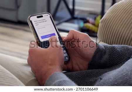Middle Aged Man Using Artificial Intelligence Career Quiz Job Bot Mobile App - AI Job Coach Concept