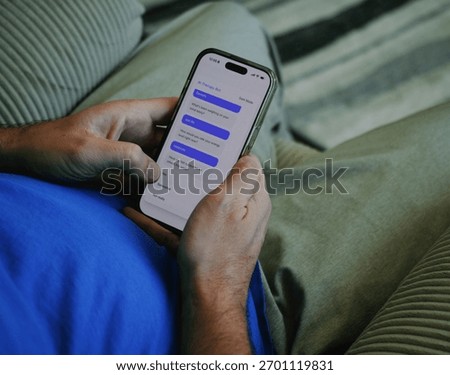 Middle Aged Man Using Artificial Intelligence Mental Health Therapy Bot at Home - AI Therapy and Counseling Concept