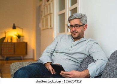 middle aged man using tablet