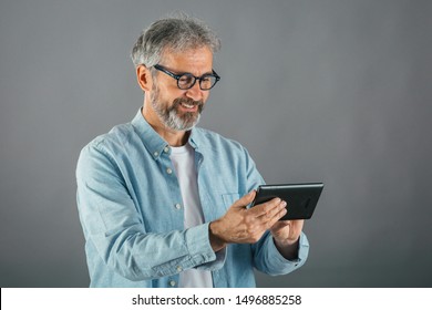 Middle Aged Man Using Tablet Isolated