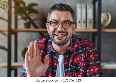 Middle Aged Man Using Video Chat In Office View From Web Camera