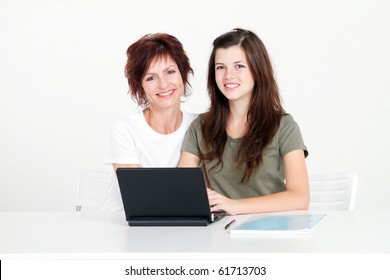 Middle Aged Mother Help Teen Daughter Studying Computer