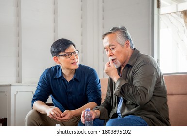 Middle aged son takes care of sick senior father, Happiness Asian family concepts - Powered by Shutterstock