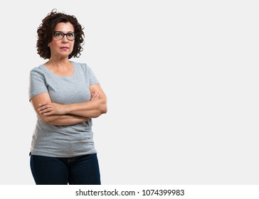 Middle Aged Woman Crossing His Arms, Serious And Imposing, Feeling Confident And Showing Power