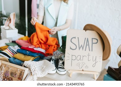 middle aged woman female woman at swap party try on clothes, bags, shoes and accessories, change clothes, second hand garment, zero waste life, eco-friendly approach to consumption, diverse people - Shutterstock ID 2143493765