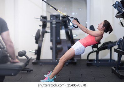 Middle aged woman in gym, health lifestyle, mature fit woman take exercises. Fitness woman workout in the gym. Fitness woman workout - Powered by Shutterstock