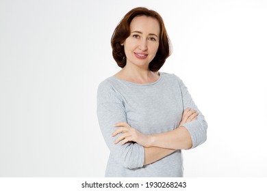 Middle aged woman healthy and happy lifestyle after menopause. Beautiful close up portrait mid age brunette woman. female isolated on white background with copy space. Menopausal and healthcare.