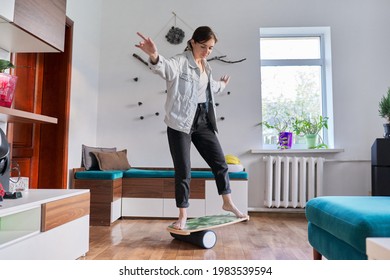 Middle Aged Woman On Fitness Balance Board