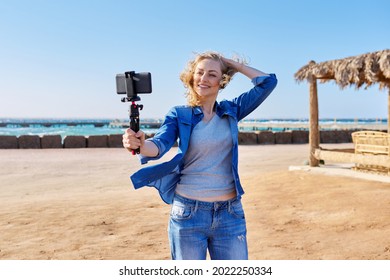 Middle Aged Woman Recording Video On Smartphone, Sea Vacation, Nature, Seascape Background