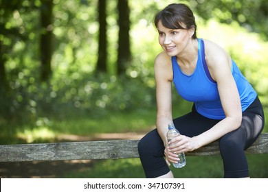 Middle Aged Woman Resting After Exercise