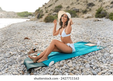 Middle aged woman resting on the beach. Disconnect from work. Reduce stress. Recharging batteries. - Powered by Shutterstock