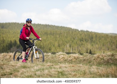 Middle Aged Woman Riding Bike 