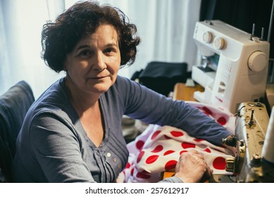 Middle aged woman sewing