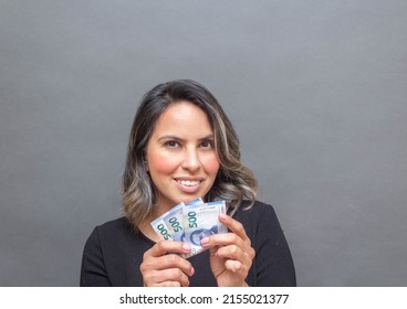 Middle Aged Woman Showing 500 Mexican Pesos Bills. Economy Concept