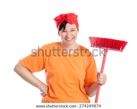Middle aged woman smiling with dotted broom isolated on white