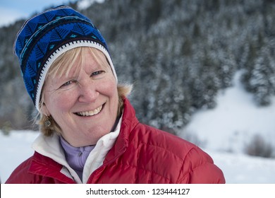 Middle Aged Woman Smiling In Winter Snow