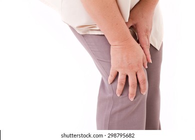 Middle Aged Woman Suffering From Knee Pain, Joint Injury Or Arthritis, Hand Holding Knee