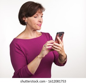 Middle Aged Woman Taking A Selfie. Gen X Social Media Concept Image