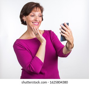 Middle Aged Woman Taking A Selfie. Gen X Social Media Concept Image