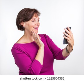 Middle Aged Woman Taking A Selfie. Gen X Social Media Concept Image