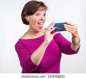 Middle Aged Woman Taking A Selfie. Gen X Social Media Concept Image