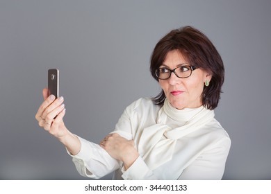 Middle Aged Woman Taking A Selfie