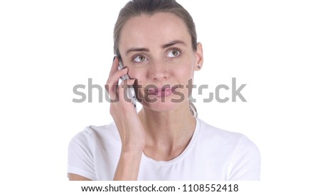 Middle Aged Womanat Work Talking on Smartphone with Customer