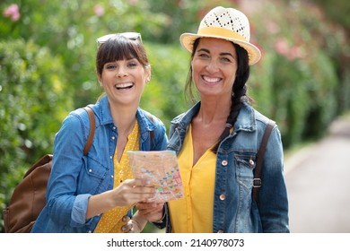 Middle Aged Women Hiking Through Countryside