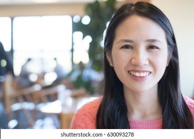 Middle Aged Women Smile Happily In The Restaurant