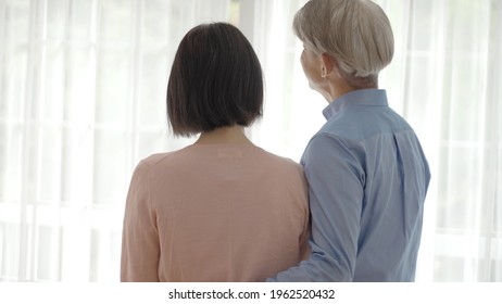 Middle Asian Couple Relaxing In The Living Room