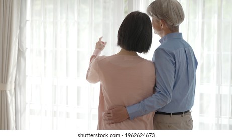 Middle Asian Couple Relaxing In The Living Room