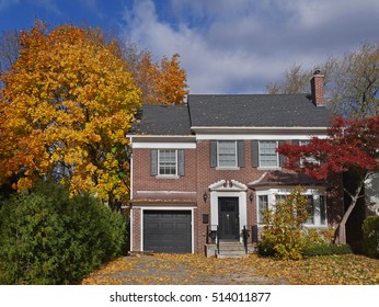 Middle Class Two Storey Brick House With Maple Tree And Fall Colors