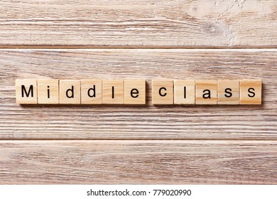 Middle Class Word Written On Wood Block. Middle Class Text On Table, Concept.