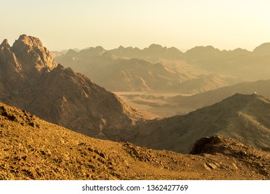 Middle East or Africa, picturesque bare mountain range and a large sandy valley desert landscapes landscape photography. Horizontal frame - Shutterstock ID 1362427769